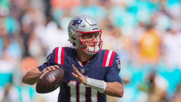 Oct 29, 2023; Miami Gardens, Florida, USA; New England Patriots quarterback Mac Jones (10) looks for a passing option against the Miami Dolphins during the first quarter at Hard Rock Stadium. Mandatory Credit: Sam Navarro-USA TODAY Sports  